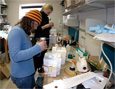 Jennifer Mercer, left, and Wiesje Mooiweer prepare ozonesondes for a balloon flight in the Crary Science and Engineering Center at McMurdo Station.