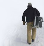 image of NOAA walking to collect samples
