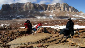 Rosemary
            Garofalo, who
            works with the
            Berg Field Center
            at McMurdo
            Station, takes
            a break from
            helping collect
            rock samples in
            an area of the
            McMurdo Dry
            Valleys near
            Mount Electra.