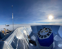 The BICEP Array telescope at South Pole, with its calibration mast in foreground and other CMB telescopes at Pole visible in the background.
Photo by Nathan Precup, for BICEP Array project.