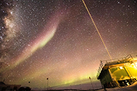 This image captures both the LiDAR systems in action, as well as polar cap auroral arcs overhead and the glow of the auroral oval near horizon. Photo by Danny Hampton, Ian Geraghty, and Zimu Li