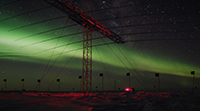 SuperDARN array with auroras in the background. Photo by Ted Lee