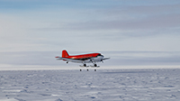 A Basler lands at South Pole Station. Photo by Danny Hampton. Image courtesy of NSF/USAP Photo Library. Creative Commons CC BY-NC-ND 4.0 courtesy of the USAP Photo Library.