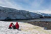 Dr. Alia Khan and Chilean colleague Edgardo Sepulveda, measure surface reflectance of snow algae. Photo by Gonzalo Barrera.

