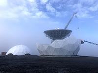 Satellite communications dish on Ross Island. Photo by Nate Parkinson, courtesy of NSF/USAP Photo Library
