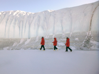 Researchers walk in front of the Canada Glacier in the Taylor Valley. Photo by Amy Chiuchiolo. Image courtesy of NSF/USAP Photo Library.