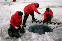 Researchers melt hole on Lake Bonney. Photo by John Priscu. Image courtesy of NSF/USAP Photo Library. Researchers melt hole on Lake Bonney. Photo by John Priscu. Image courtesy of NSF/USAP Photo Library.