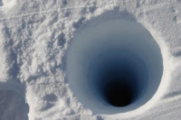 Borehole in West Antarctic Ice Sheet to gather ice core samples. Photo by Steven Profaizer, courtesy of the USAP Photo Library. 