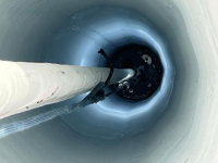 Firn hole to gather ice core samples. Photo by Ian Crocker, courtesy of USAP Photo Library. 