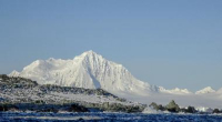 A snow-covered mountain and the ocean in the Antarctic Peninsula. Photo by Cynthia Spence, courtesy of the USAP Photo Library.
