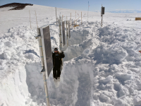 Digging out buried instruments on Ross Island. Photo by Avilash Cramer. Image courtesy of NSF/USAP Photo Library.
