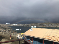 A rainbow over Bonaparte Point at NSF Palmer Station, located on Anvers Island in the Antarctica Peninsula. Photo by Katie Harrison, courtesy of the USAP Photo Library.