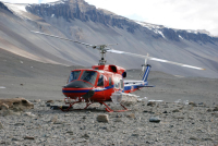 A U.S. Antarctic Program helicopter sits on the ground near Lake Vanda, Wright Valley, McMurdo Dry Valleys. Photo by Elaine Hood, courtesy of the USAP Photo Library.