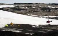 A helicopter lands near a field camp in the Allan Hills. Photo by Peter Rejcek, courtesy of the USAP Photo Library.