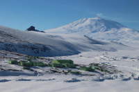 Mt. Erebus in the background, with the buildings of Scott Base in the foreground. Photo by Phil Wannamaker, courtesy of the USAP Photo Library.