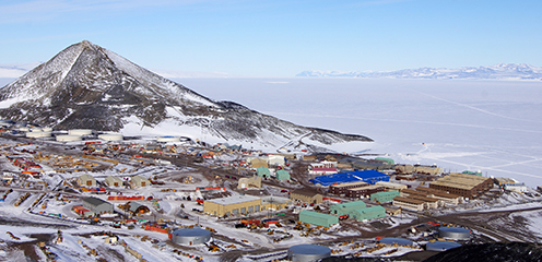 An aerial view of Observation Hill and McMurdo Station below it